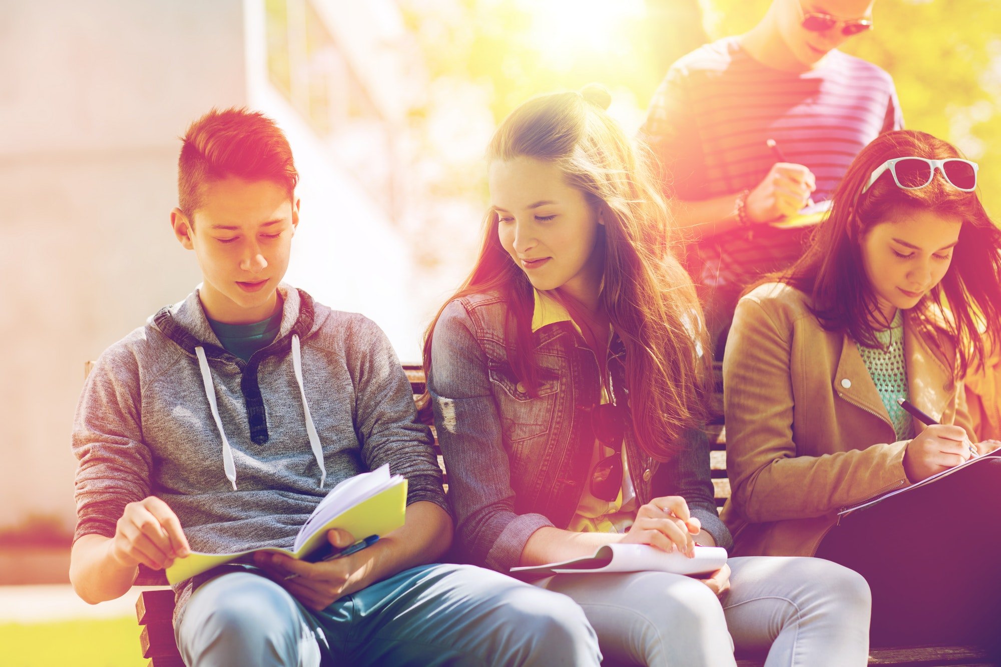 group of students with notebooks at school yard